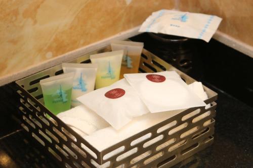 a basket filled with towels and krispy krispy treats at Dahlia Boutique Hotel in Pokhara