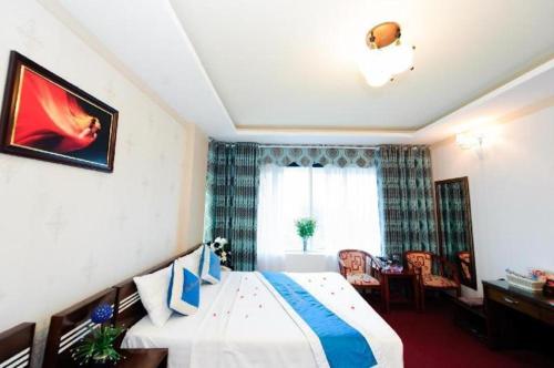 a hotel room with a bed and a window at Hanoi Dai Duong Hotel 1 in Hanoi