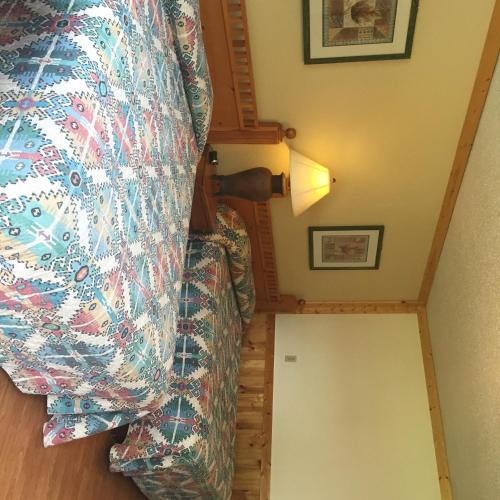 an overhead view of a room with a bed and a staircase at Z Bar Motel in Buffalo