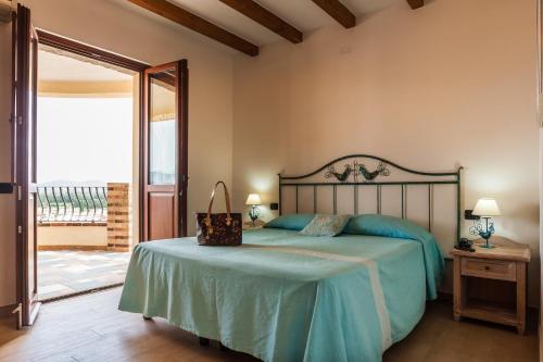 Ένα ή περισσότερα κρεβάτια σε δωμάτιο στο Residenza Petrera