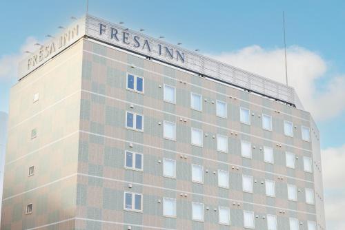 a building with a sign on the top of it at Sotetsu Fresa Inn Yokohama Totsuka - Renovated in March 31st 2025 in Yokohama