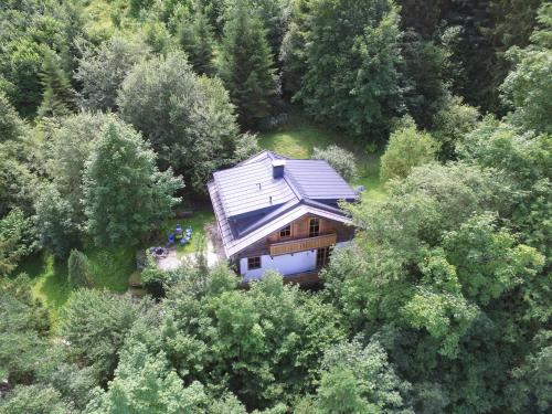 an overhead view of a house in the woods at Chalet with Views, Privacy & Fire in Kaprun in Kaprun