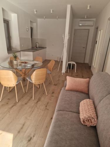 a living room with a couch and a table at Antica Dolina in Postojna
