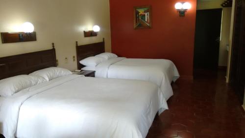 Cama o camas de una habitación en Hotel Mi Ranchito