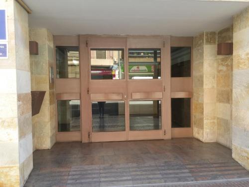 a pair of glass doors in a building at Pensión Saint Mateo in Logroño