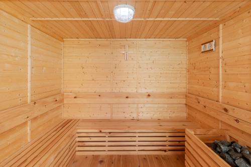 a wooden sauna with a wooden floor at Entikko Safari Lodge in Fajao