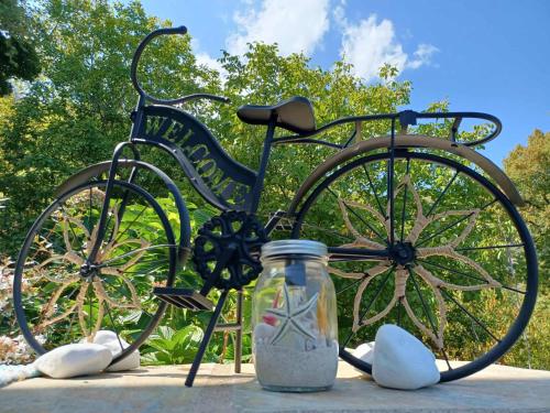 a bicycle with a mason jar in front of it at Ioni Home in Tsagarada