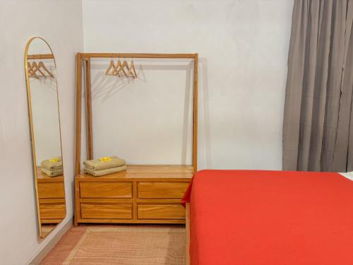 a dressing room with a mirror and a dresser at Rumah Tetangga Jogja - 4BR Villa Near Keraton in Ngabean