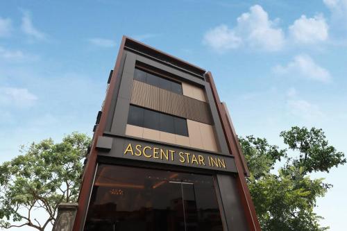 a apartment building with a sign that reads agent star inn at Ascent Star Inn in Mumbai