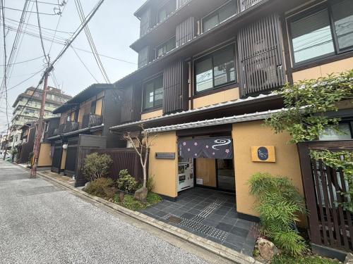 a building on the side of a street at Kyoto Gojo T 京都五条ツイン in Kyoto