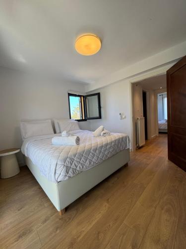 a bedroom with a large bed in a room at Aegina Horizon Stonehouse No I in Aegina
