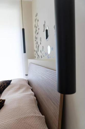 a bedroom with a bed and a tub in a room at A casa di Clà in Gaeta