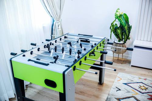 a large foosball table in a living room at Stylish Lekki Phase 1 1BR Flat 24/7 Power in Lekki Phase 1