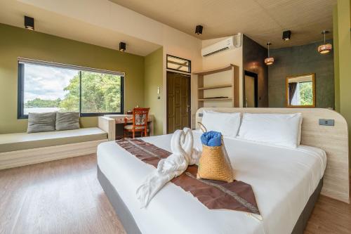 Ένα ή περισσότερα κρεβάτια σε δωμάτιο στο Binlha Raft Resort