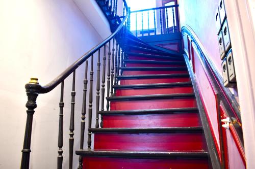 a staircase in a building with red and blue at Domus Lemaitre 3, 2 people, Wi-Fi, mezzanine bed in Bavay