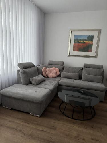 a living room with a couch and a table at Hotel & Restaurant Frechen in Frechen