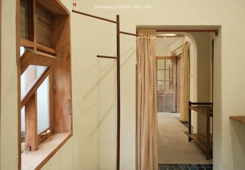 a hallway of a house with a door to a room at Dreamville Beach Homestay in Phu Yen