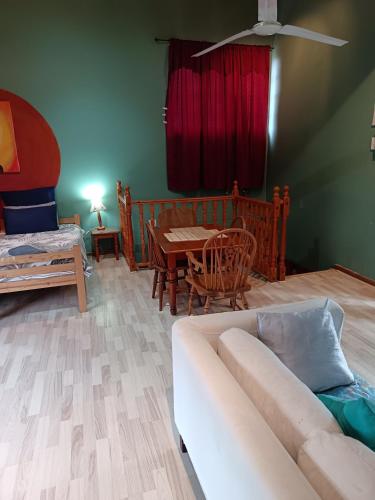a living room with a couch and a table at Apartment-double storey-2 bedrooms-own bathroom, kitchen, dining room, entrance, lounge, patio in Pinetown