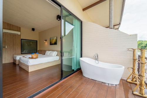 Ένα ή περισσότερα κρεβάτια σε δωμάτιο στο Binlha Raft Resort