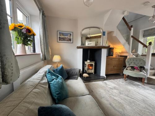 a living room with a couch and a fireplace at Tranquil Seabreeze in Seaview