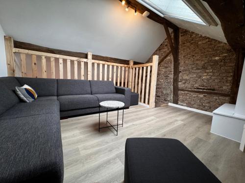 a living room with a couch and a table at La Rocha in La Roche-en-Ardenne