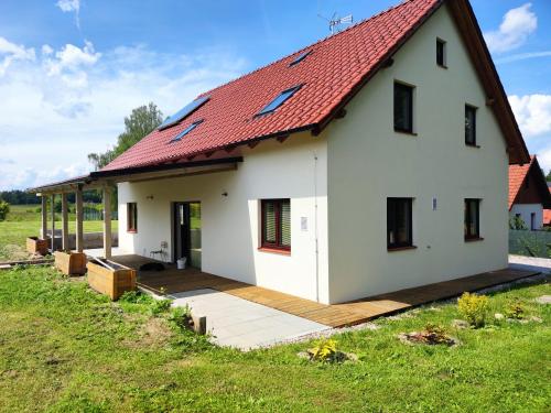 a large white house with a red roof at Chalupa Seč in Seč