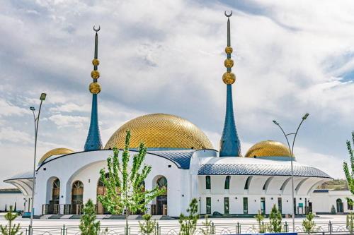 a mosque with two domes on top of it at City Center Apartment "Afsona mall" in Irvadan