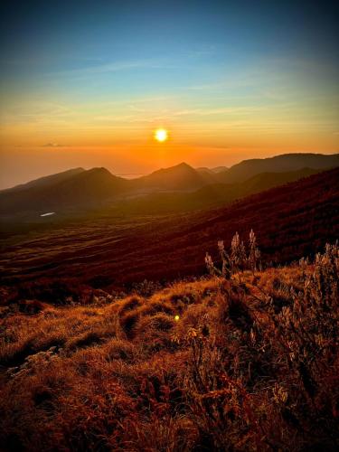 a view of the sunset from the top of a hill at Harmony hill in Bayan