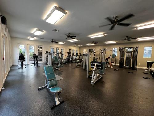 a gym with treadmills and chairs in a room at Cozy Luxurious Spacious Apt with Valley View, Attached Garage,Pool,24-Hour Gym, 3 TV in Mission Viejo