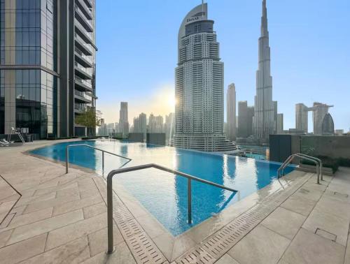 a swimming pool on the roof of a building at Stunning 1 Bedroom at Boulevard Point with Infinity Pool connected to Dubai Mall by Luxury Space in Dubai