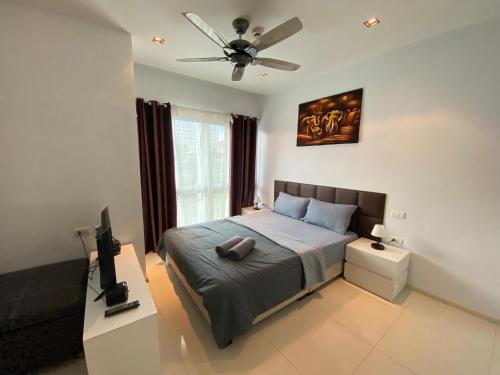 Postel nebo postele na pokoji v ubytování The Gallery Condo