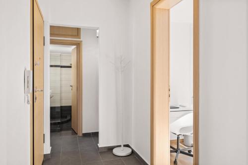 a room with a hallway with a mirror and a table at Luxury 2BR Penthouse Marina & Sea Views in Piraeus