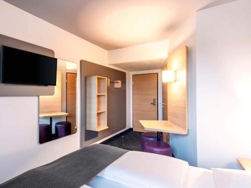 Postel nebo postele na pokoji v ubytování B&B Hotel Regensburg-City