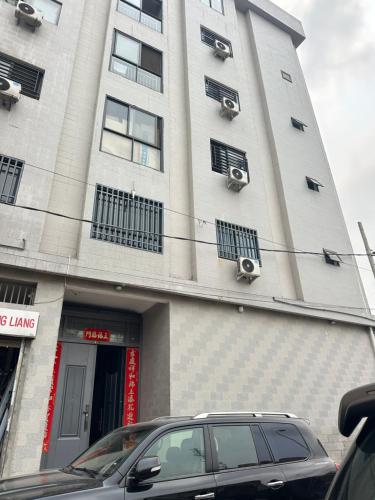 a car parked in front of a building at Easy home in Brazzaville
