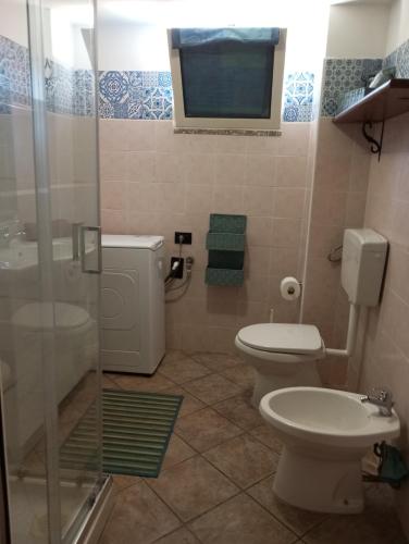 a bathroom with a toilet and a sink and a shower at SA FraDa in Olmedo