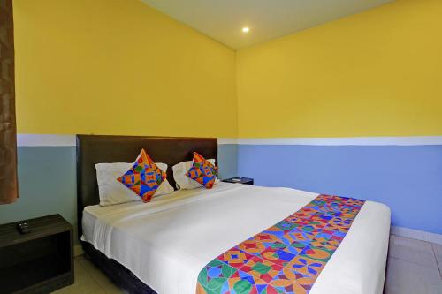 Postel nebo postele na pokoji v ubytování FabHotel 29 Beach House