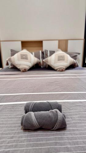 a stuffed animal laying on the floor in a room at White Pearl 2BR Beachfront House Malibu Seaview in Mae Haad