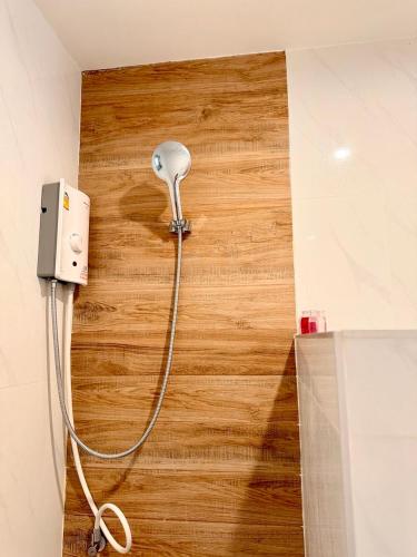 a room with a light plugged into a wall at White Pearl 2BR Beachfront House Malibu Seaview in Mae Haad