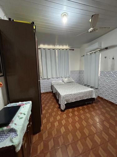 a room with two beds and a sink in it at Casa no Centro para COP 30 e Círio in Belém
