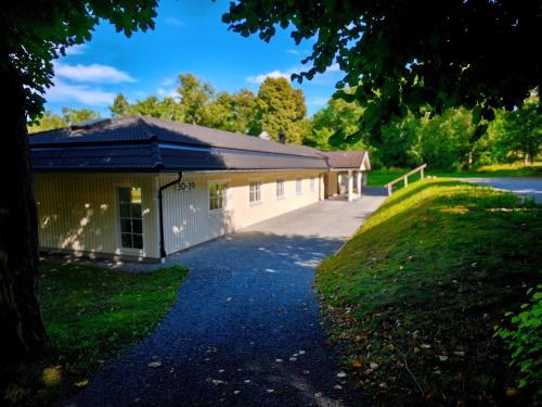 a building with a driveway in front of it at Baldersnäs Herrgård in Dals Långed