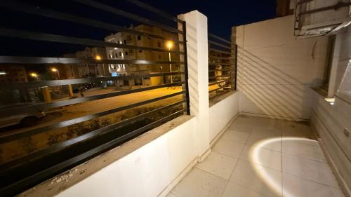 a bathroom with a window with a view of a city at جاردن هوم الارضي مع البول Garden Home with pool ال عصام in 6th Of October