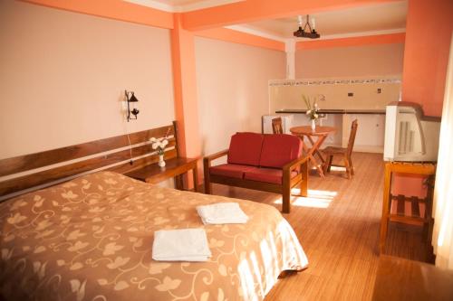 Postel nebo postele na pokoji v ubytování Comodo Estudio Matrimonial centro Sucre