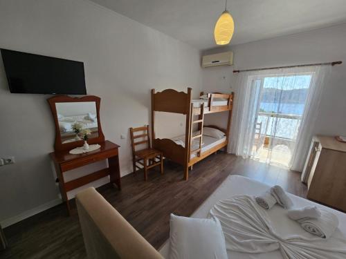 En eller flere senge i et værelse på Vila Teo