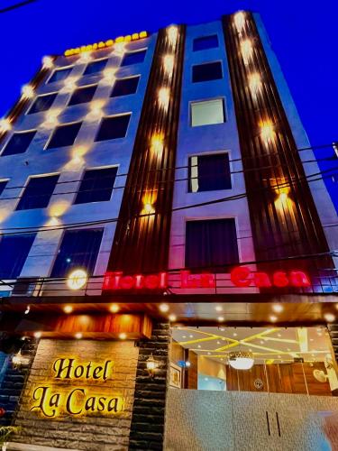 a hotel caesar osaka building with a hotel la casa at Hotel La Casa, Amritsar #swimming pool #prime location #luxury rooms #best selling near golden temple in Amritsar