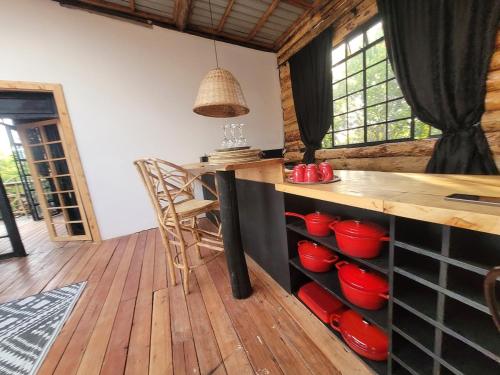 a kitchen with a counter with red bowls on it at DesertDewEstate in Nanyuki