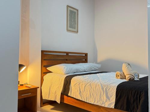 a bedroom with two beds and a teddy bear on the bed at Tena Tower House TTH in Tena