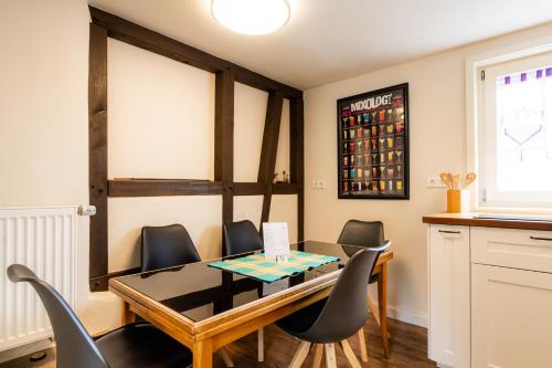 a dining room with a table and chairs at Der Gastfreund in Burghaun in Burghaun