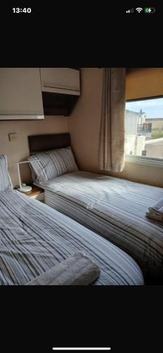 Ένα ή περισσότερα κρεβάτια σε δωμάτιο στο Luxury Holiday mobile home