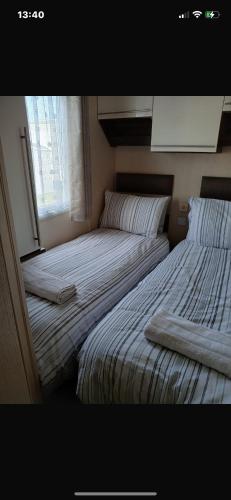 Ένα ή περισσότερα κρεβάτια σε δωμάτιο στο Luxury Holiday mobile home