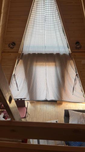 a view of a large window in a room at Podgoricka Koliba 